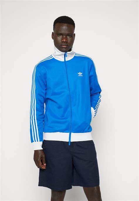 adidas blaue trainingsjacke weisses blatt rücken|Blaue Sweatjacken .